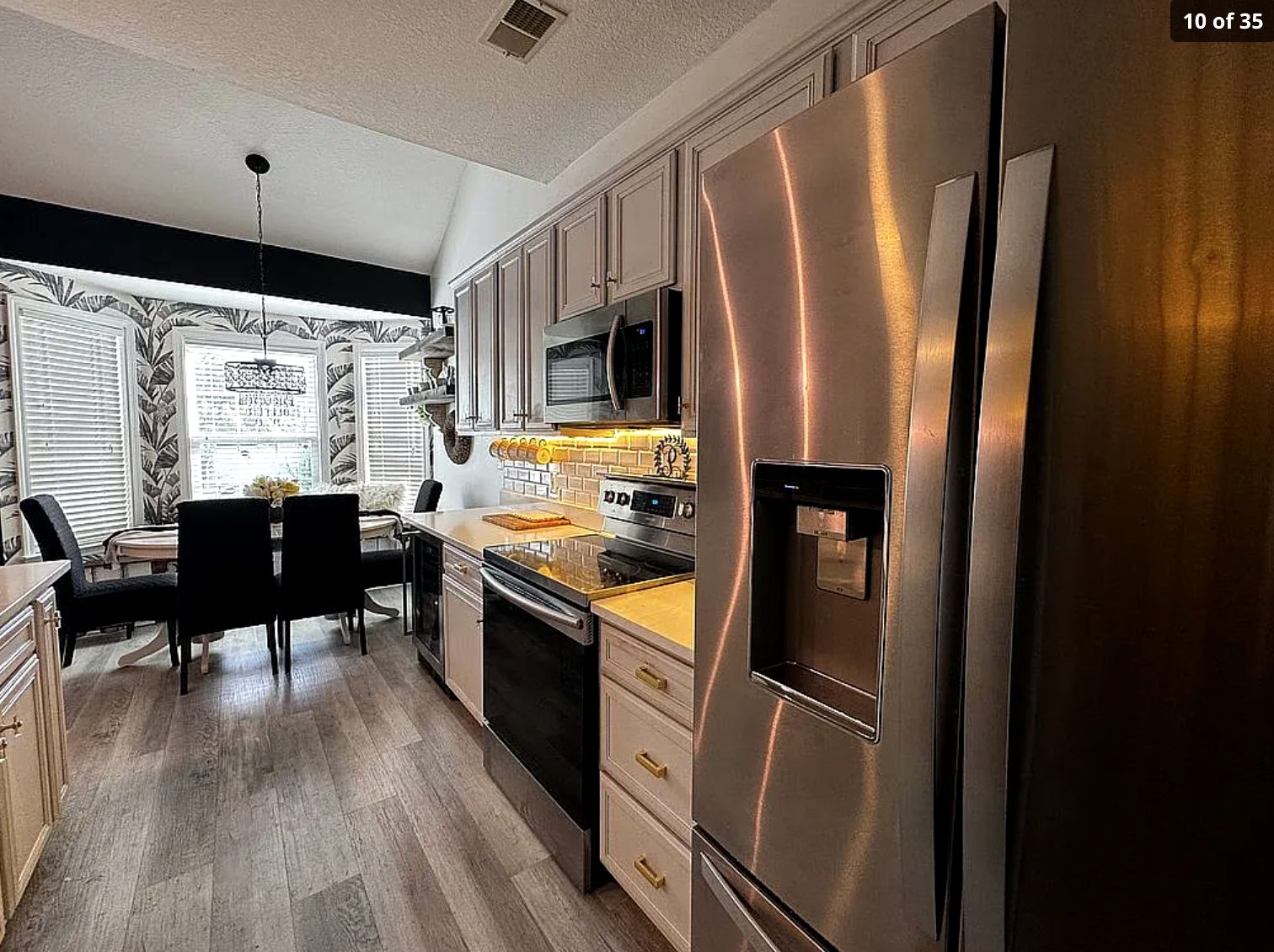 Kitchen with stainless appliances and dining nook